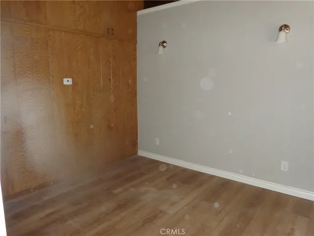 a view of hallway with wooden floor