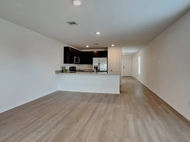 a view of a kitchen with a sink and a microwave