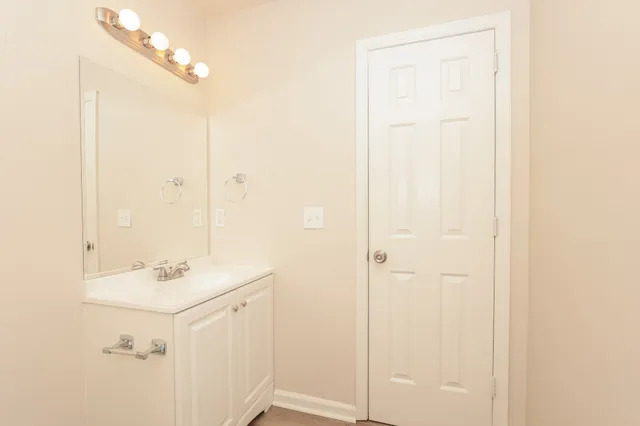 a bathroom with a sink a mirror and a shower
