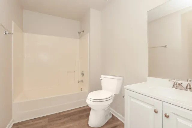 a bathroom with a toilet sink and a bathtub