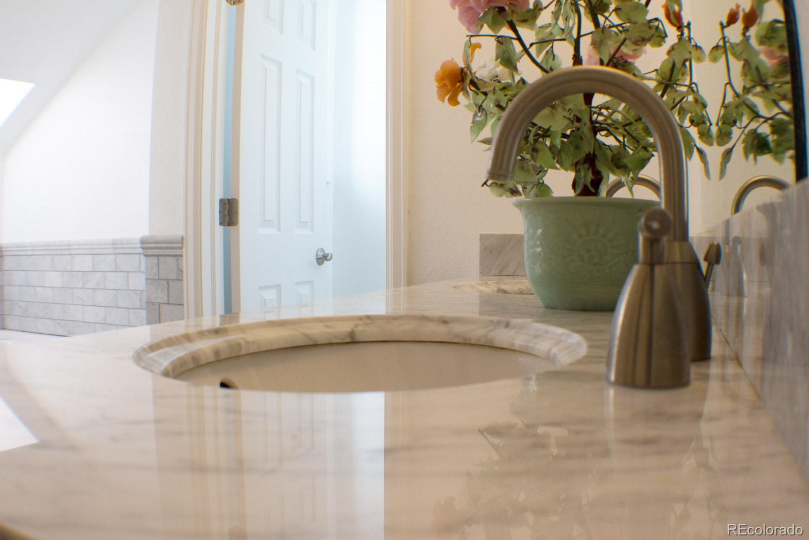 3596 South Telluride Way Aurora, CO 80013 - Photo 14 of 17 a bathroom with a tub