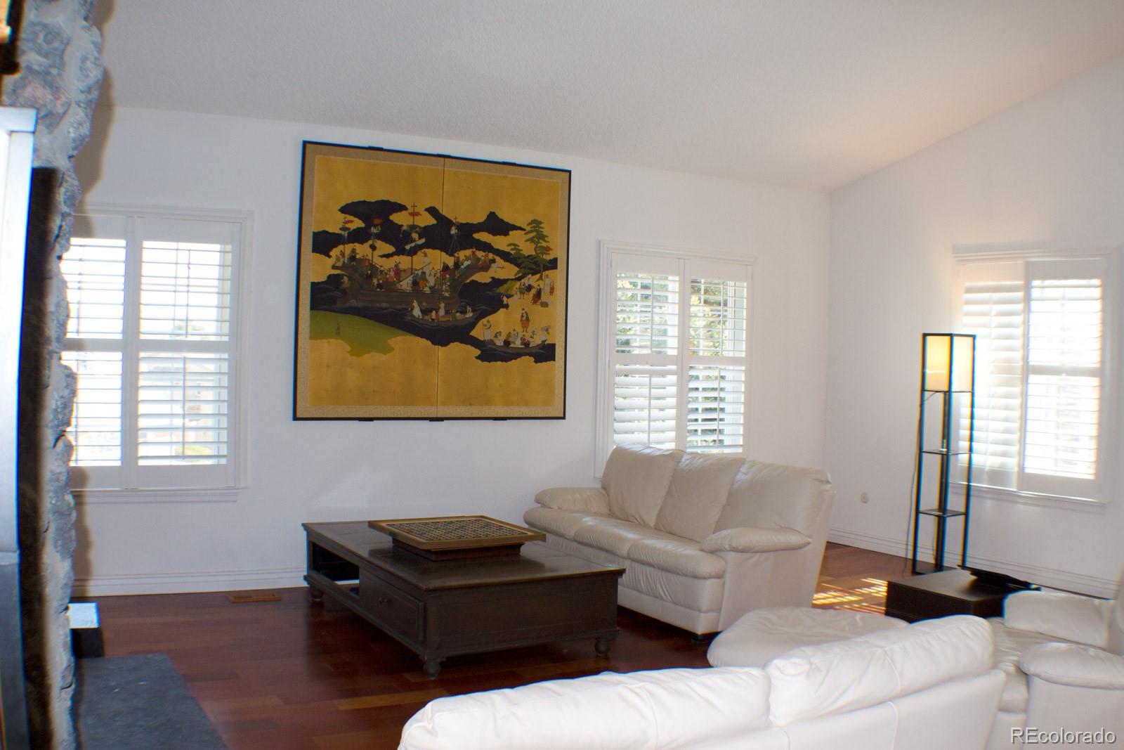 3596 South Telluride Way Aurora, CO 80013 - Photo 10 of 17 a living room with furniture and a window