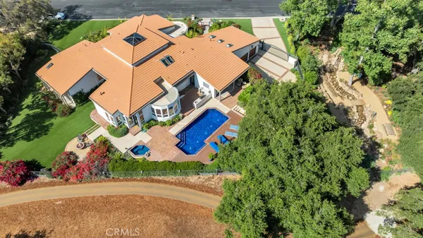 a view of a swimming pool with a yard