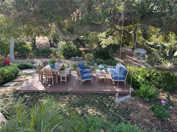 a view of a swimming pool with an outdoor space and seating area