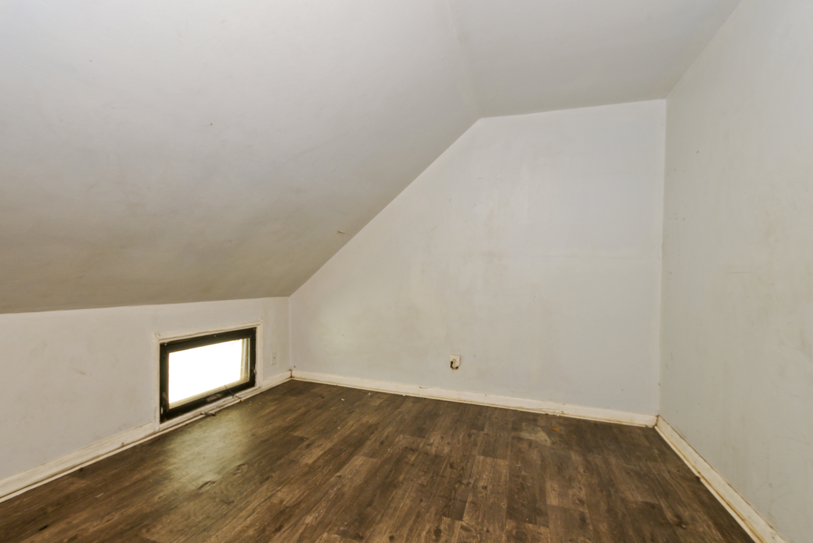 10320 South Indiana Avenue Chicago, IL 60628 - Photo 15 of 24 a view of empty room with wooden floor and window