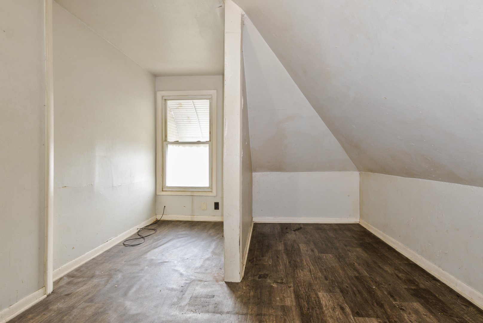 10320 South Indiana Avenue Chicago, IL 60628 - Photo 16 of 24 a view of a room with wooden floor and white walls