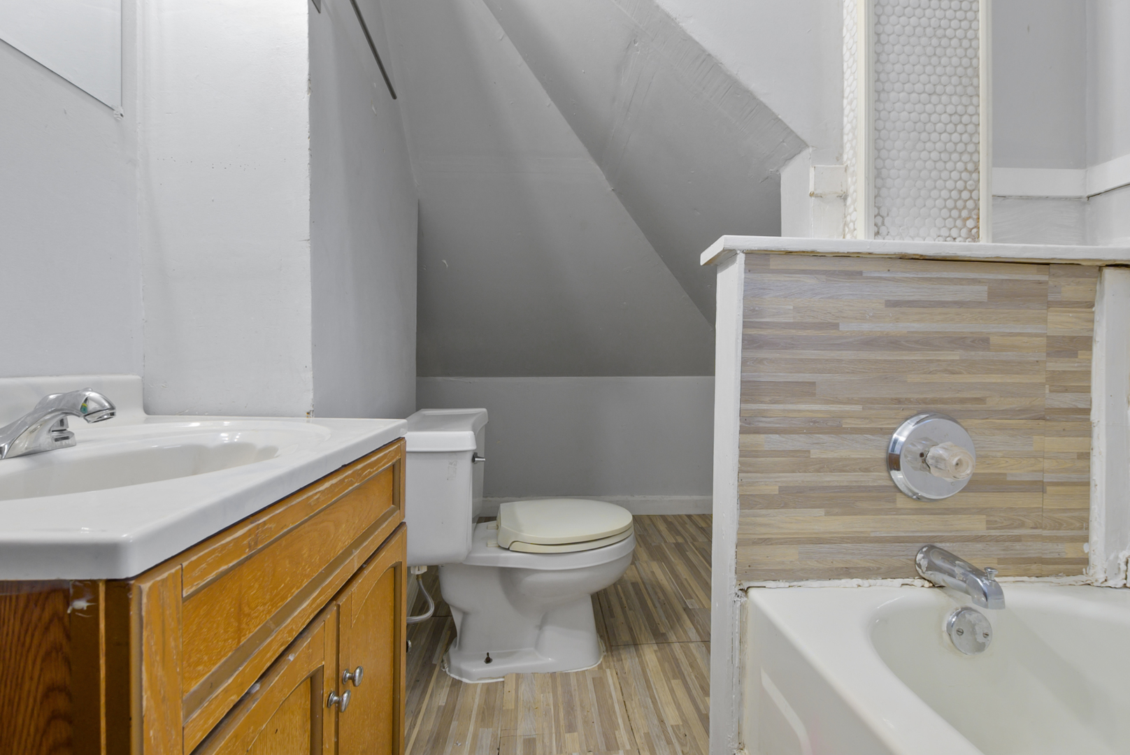 10320 South Indiana Avenue Chicago, IL 60628 - Photo 17 of 24 a bathroom with a sink and a toilet