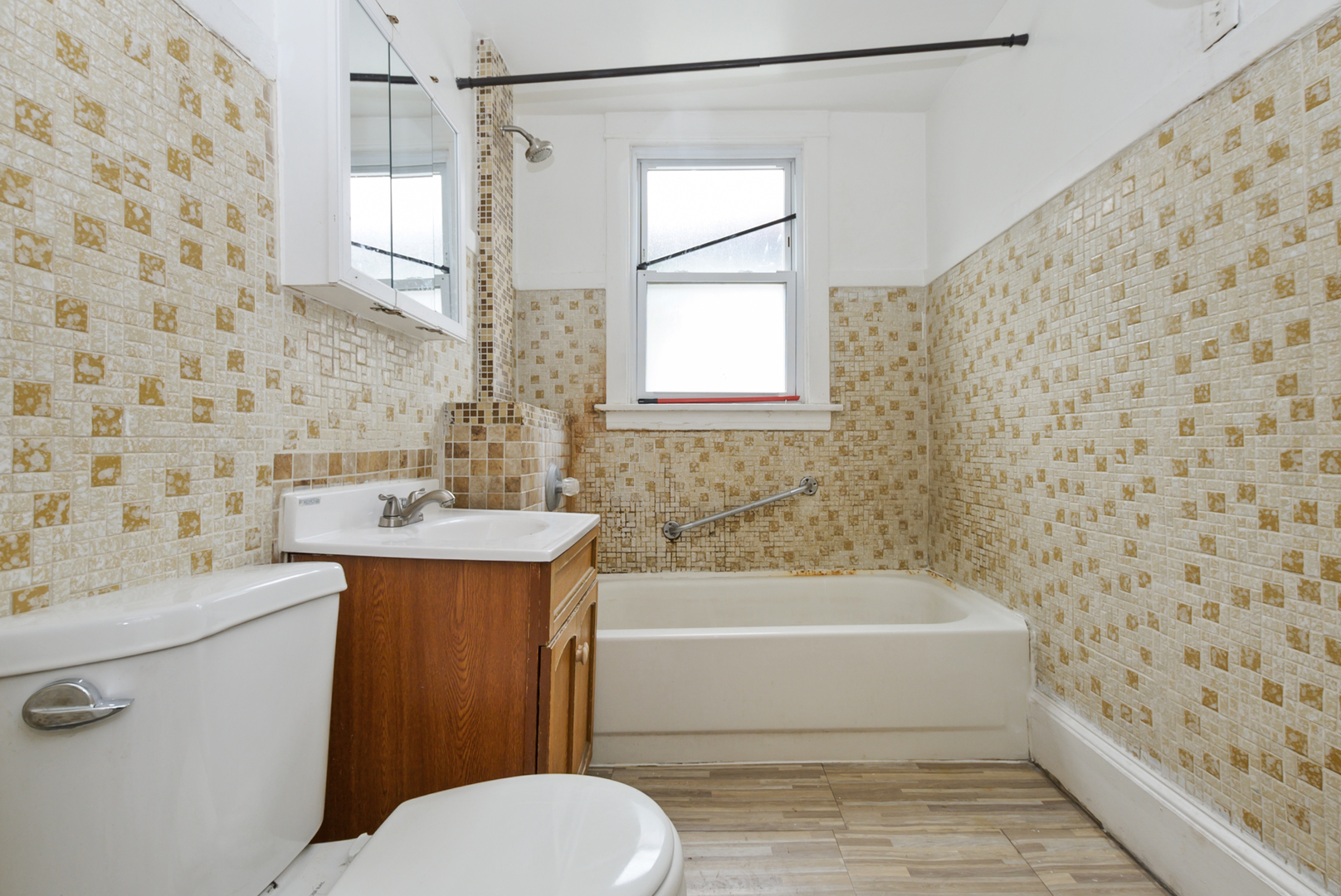 10320 South Indiana Avenue Chicago, IL 60628 - Photo 8 of 24 a bathroom with a sink toilet and shower