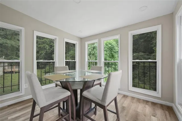 a view of a dining room with furniture window and outside view
