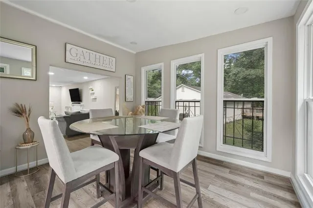 a view of a dining room with furniture window and outside view
