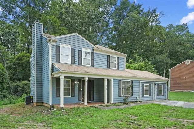 front view of a house with a yard