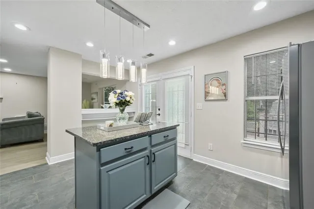 a bathroom with a sink a vanity and a mirror