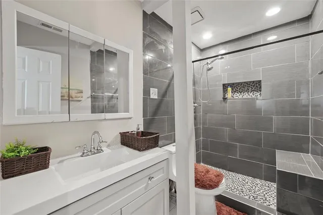 a bathroom with a sink and a shower