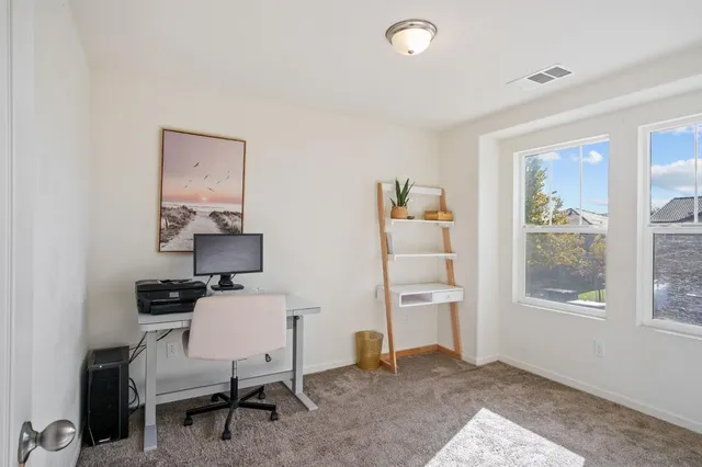 a workspace with furniture and a window