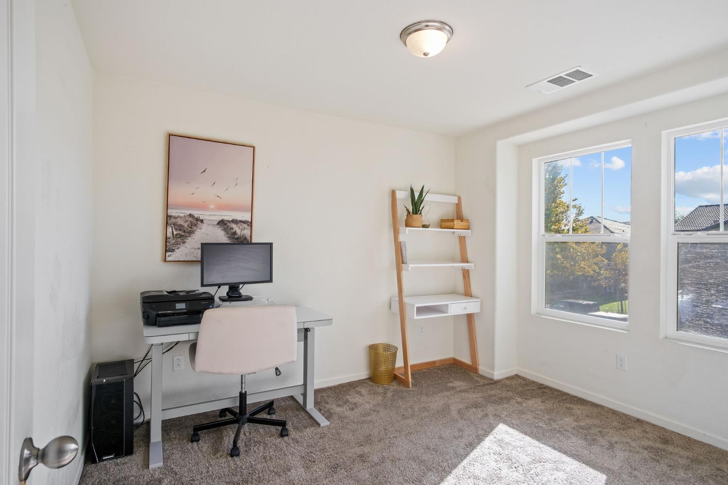 767 Day Break Way Ceres, CA 95307 - Photo 14 of 28 a workspace with furniture and a window