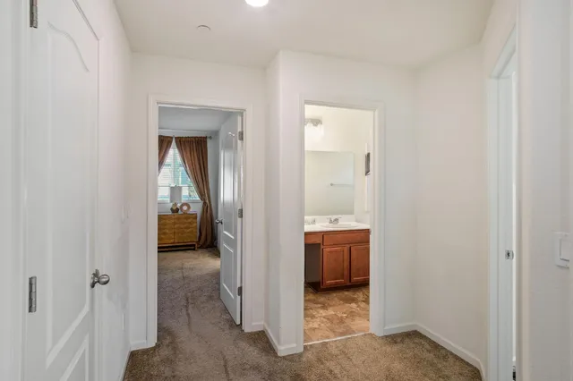 a view of a bathroom from a hallway