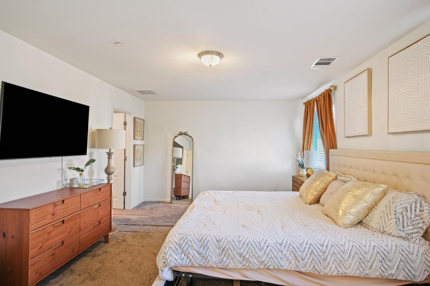 767 Day Break Way Ceres, CA 95307 - Photo 19 of 28 a bedroom with a bed and a flat screen tv