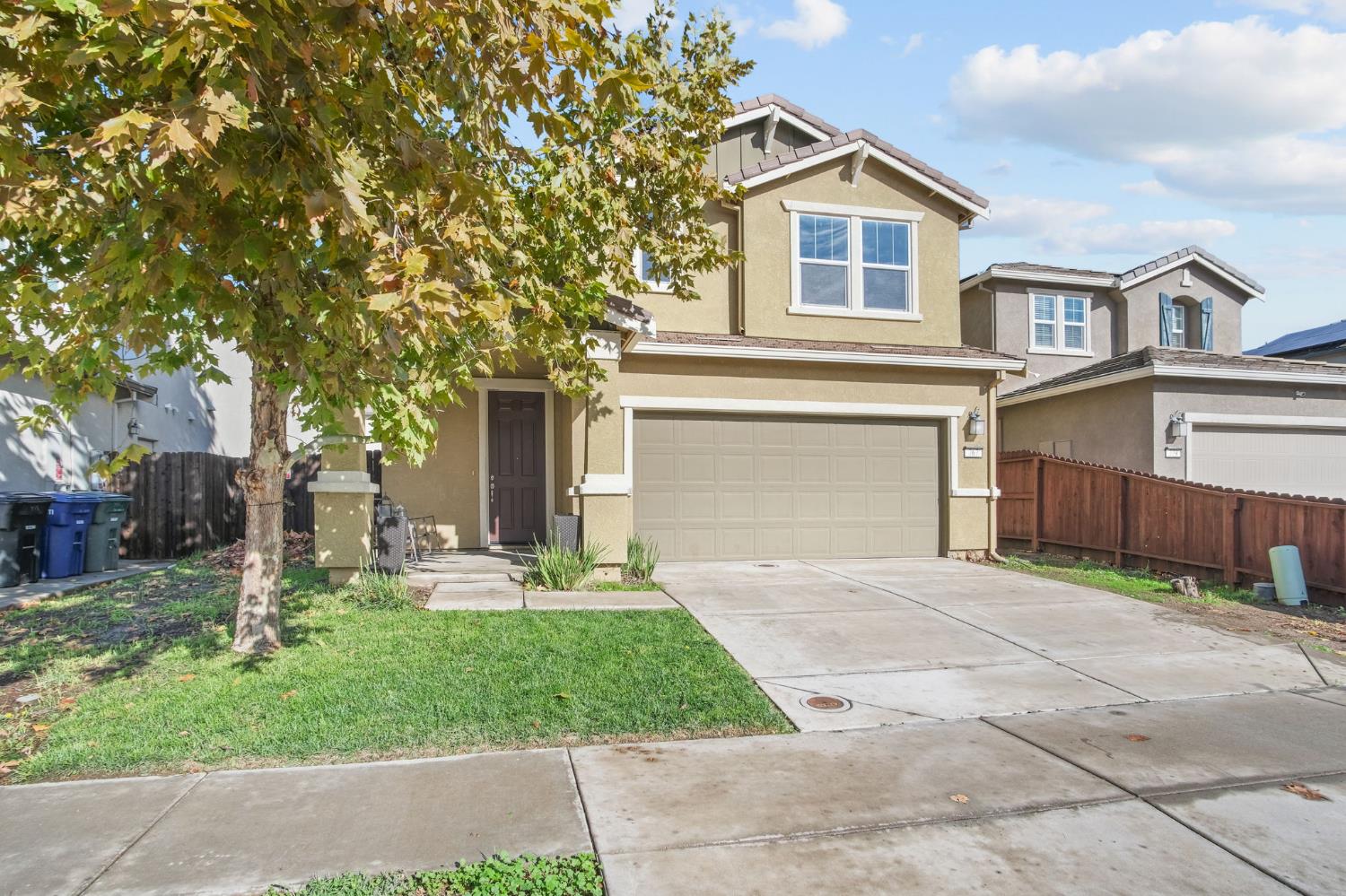 767 Day Break Way Ceres, CA 95307 - Photo 2 of 28 a front view of a house with garden