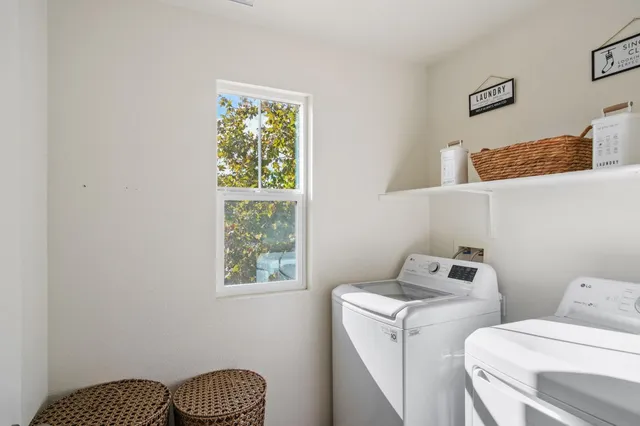 a view of storage and utility room with washer and dryer