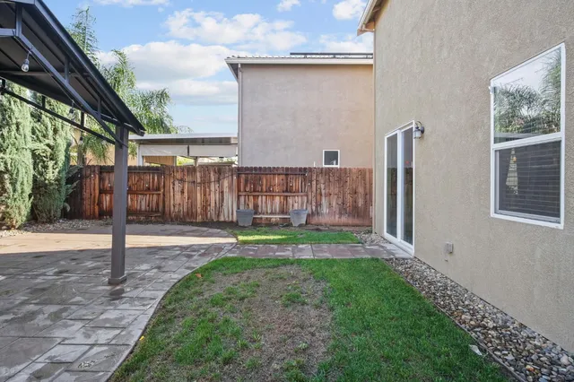 a view of a backyard with barn and a large window