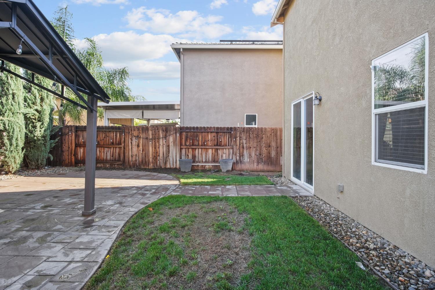 767 Day Break Way Ceres, CA 95307 - Photo 26 of 28 a view of a backyard with barn and a large window