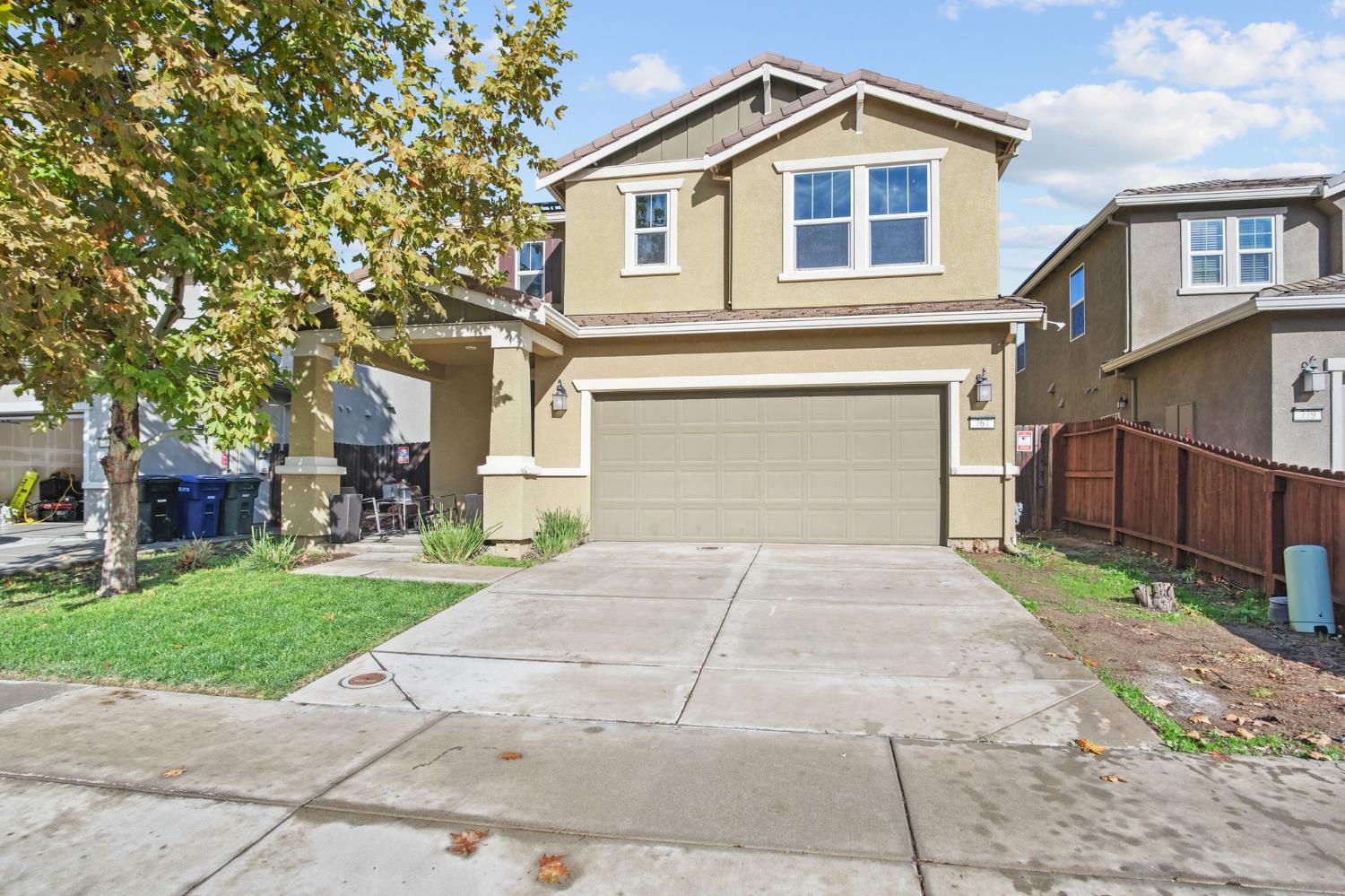 767 Day Break Way Ceres, CA 95307 - Photo 27 of 28 a front view of a house with a yard and garage