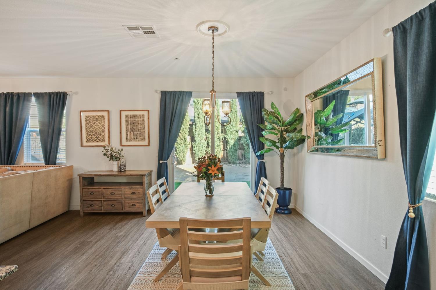 767 Day Break Way Ceres, CA 95307 - Photo 7 of 28 a living room with furniture and a chandelier