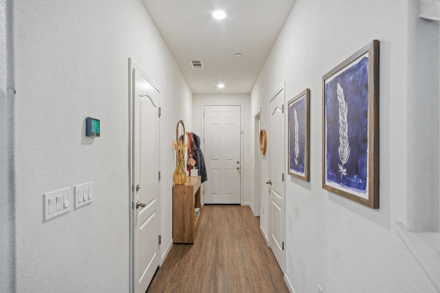 767 Day Break Way Ceres, CA 95307 - Photo 10 of 28 a view of a hallway with wooden floor and entryway