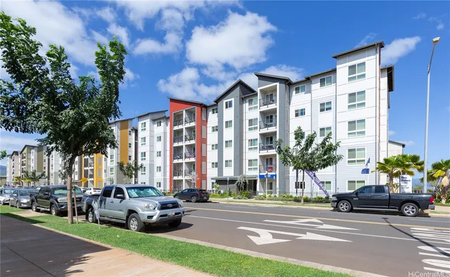 a front view of a house with porch and garden