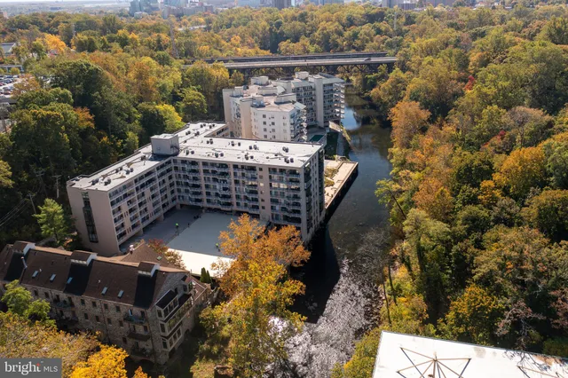 an aerial view of a house with a yard basket ball court and outdoor seating
