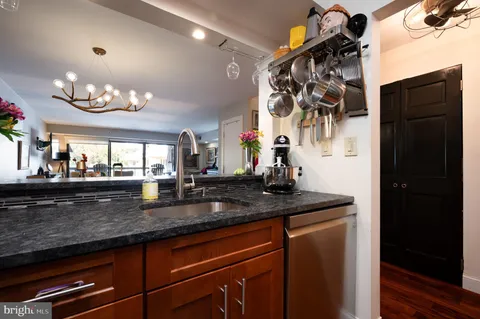 a kitchen with a sink and a refrigerator