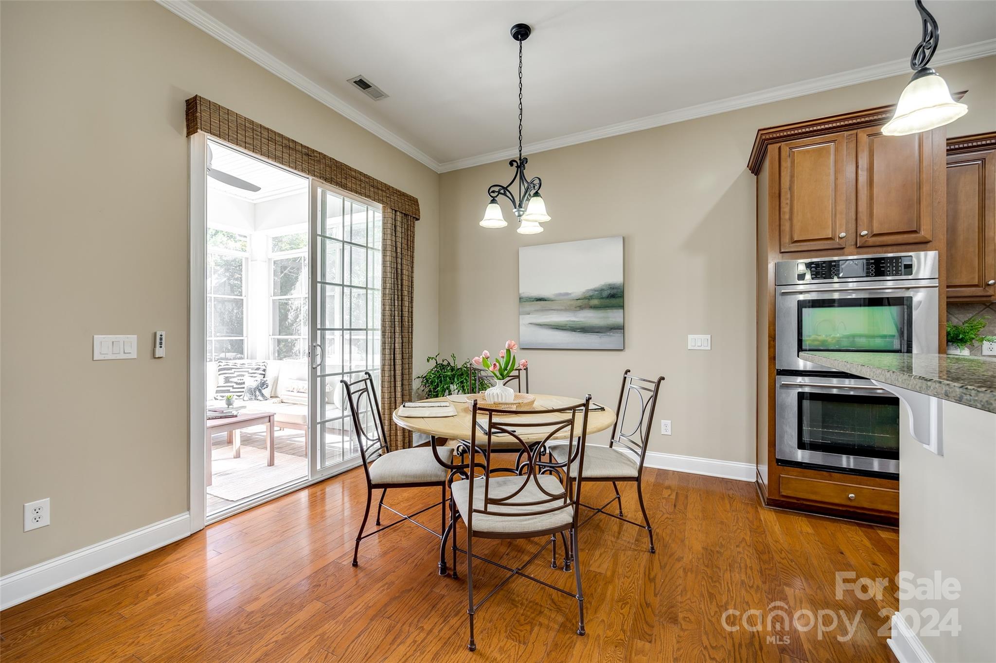 674 Quicksilver Trail Fort Mill, SC 29708 - Photo 11 of 45 a dining room with furniture window wooden floor and a chandelier