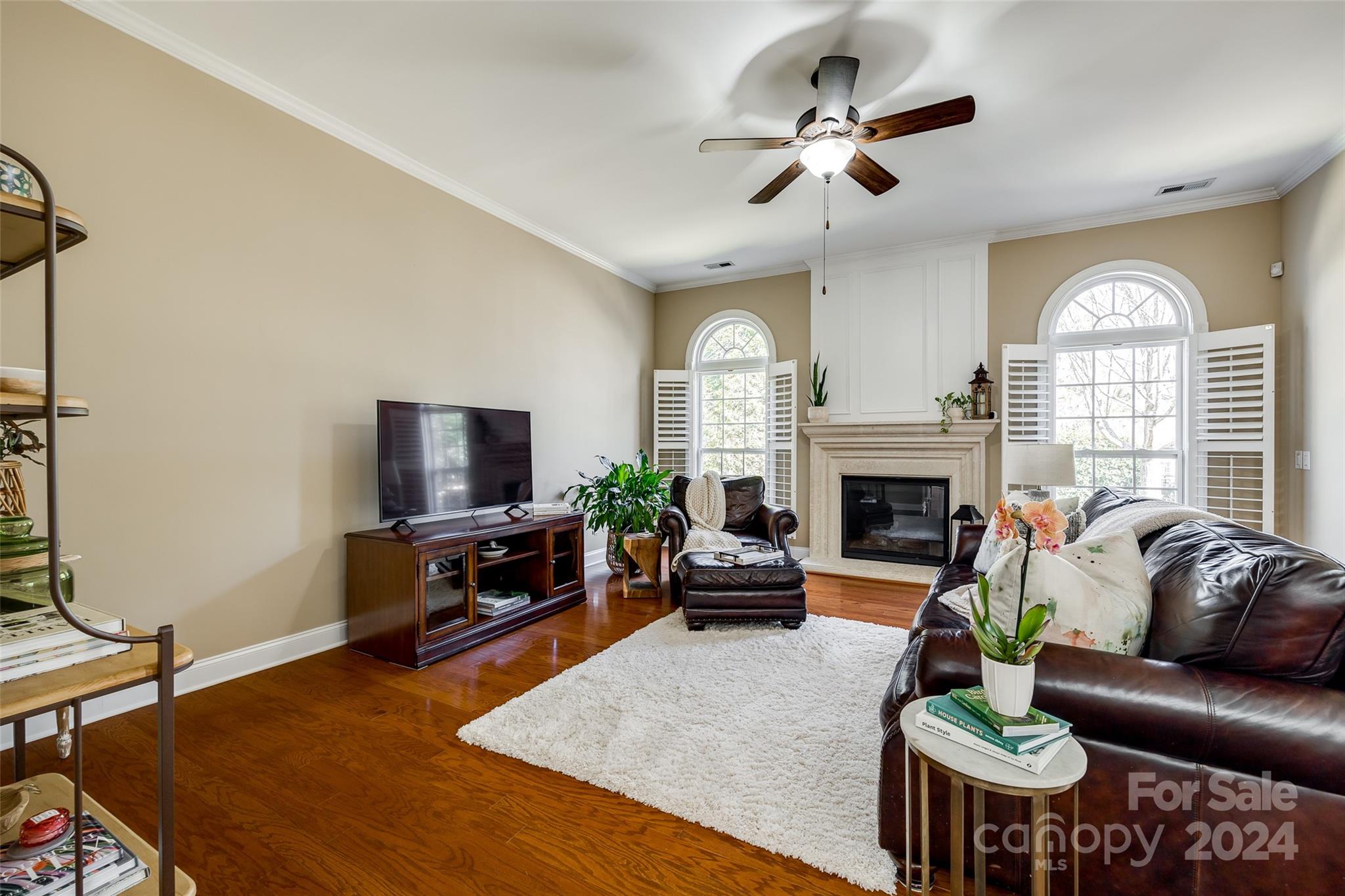 674 Quicksilver Trail Fort Mill, SC 29708 - Photo 12 of 45 a living room with furniture a fireplace and a flat screen tv