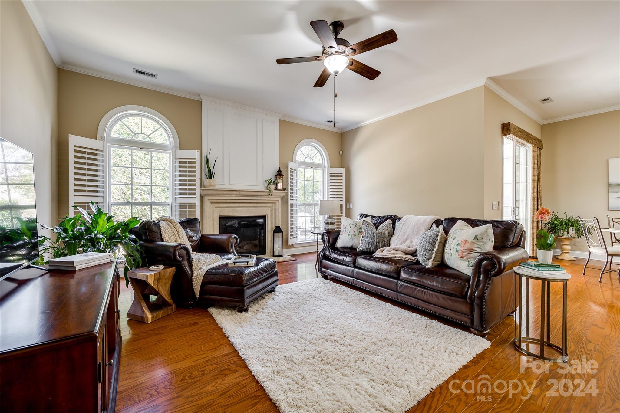 674 Quicksilver Trail Fort Mill, SC 29708 - Photo 14 of 45 a living room with furniture a fireplace and a large window