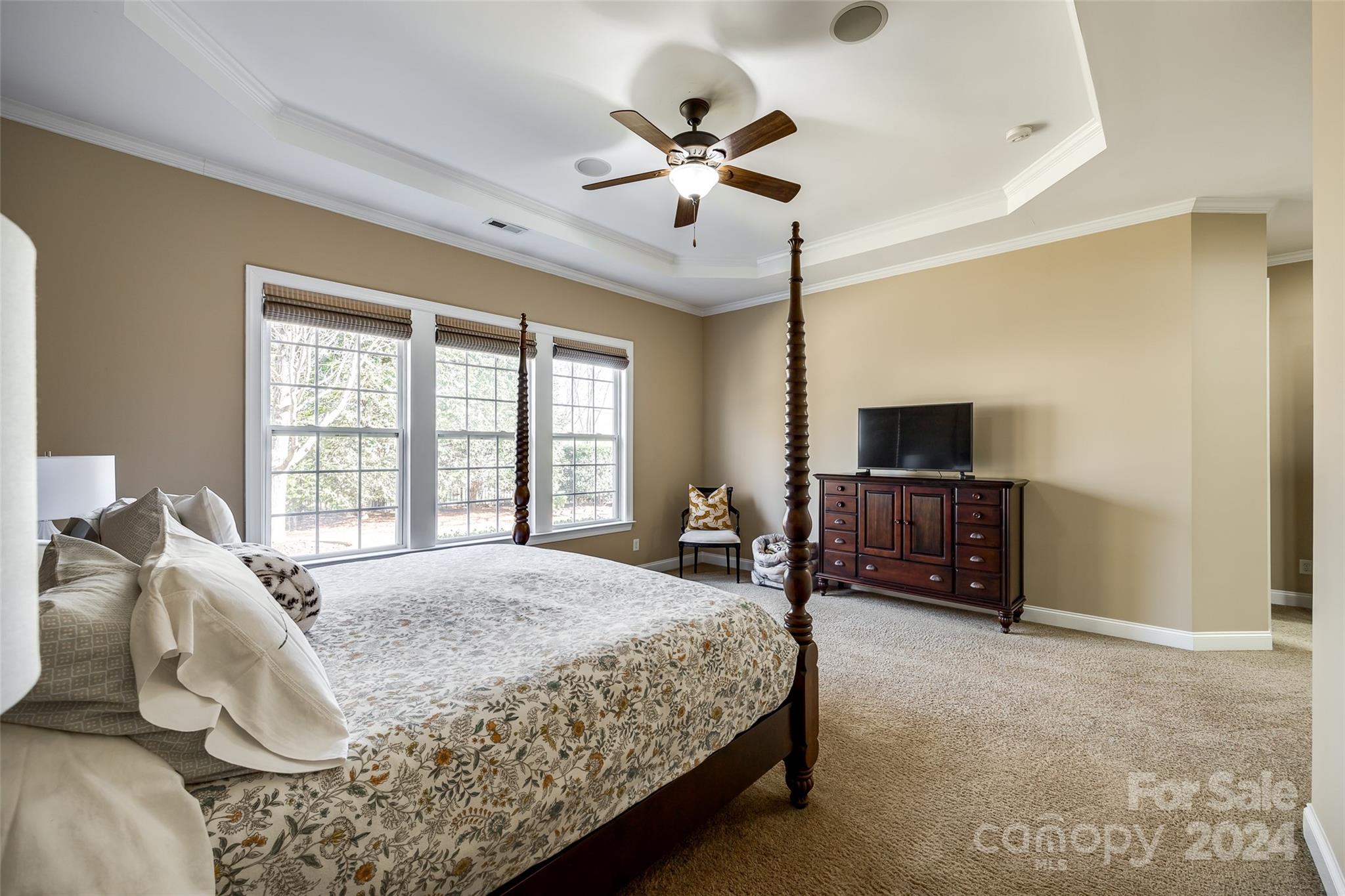 674 Quicksilver Trail Fort Mill, SC 29708 - Photo 16 of 45 a bedroom with a bed and a flat screen tv