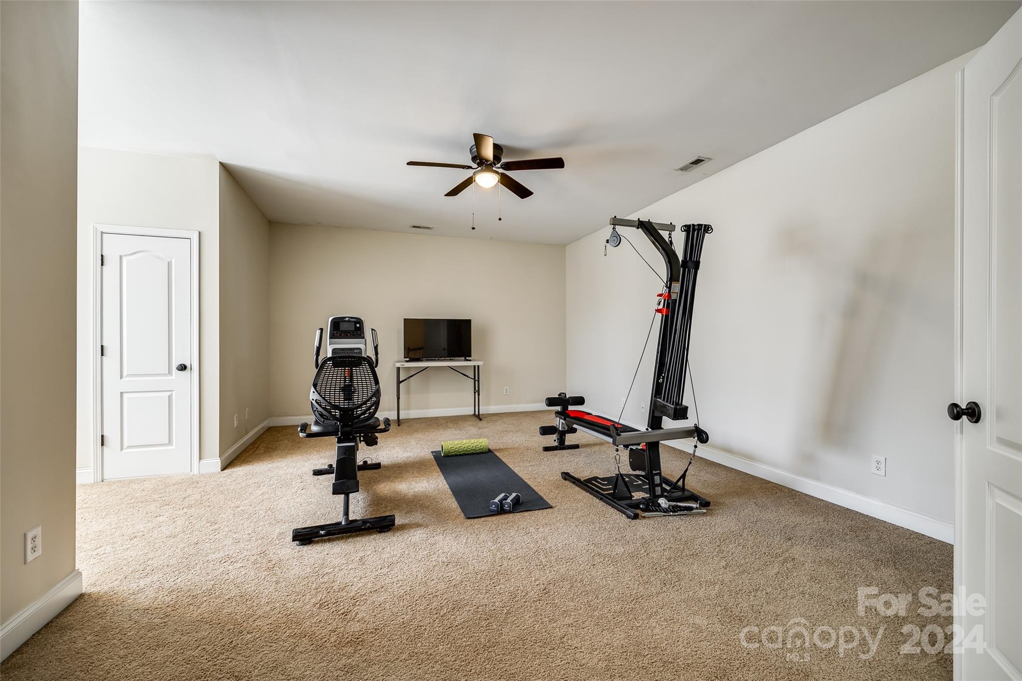 674 Quicksilver Trail Fort Mill, SC 29708 - Photo 21 of 45 a view of a room with gym equipment