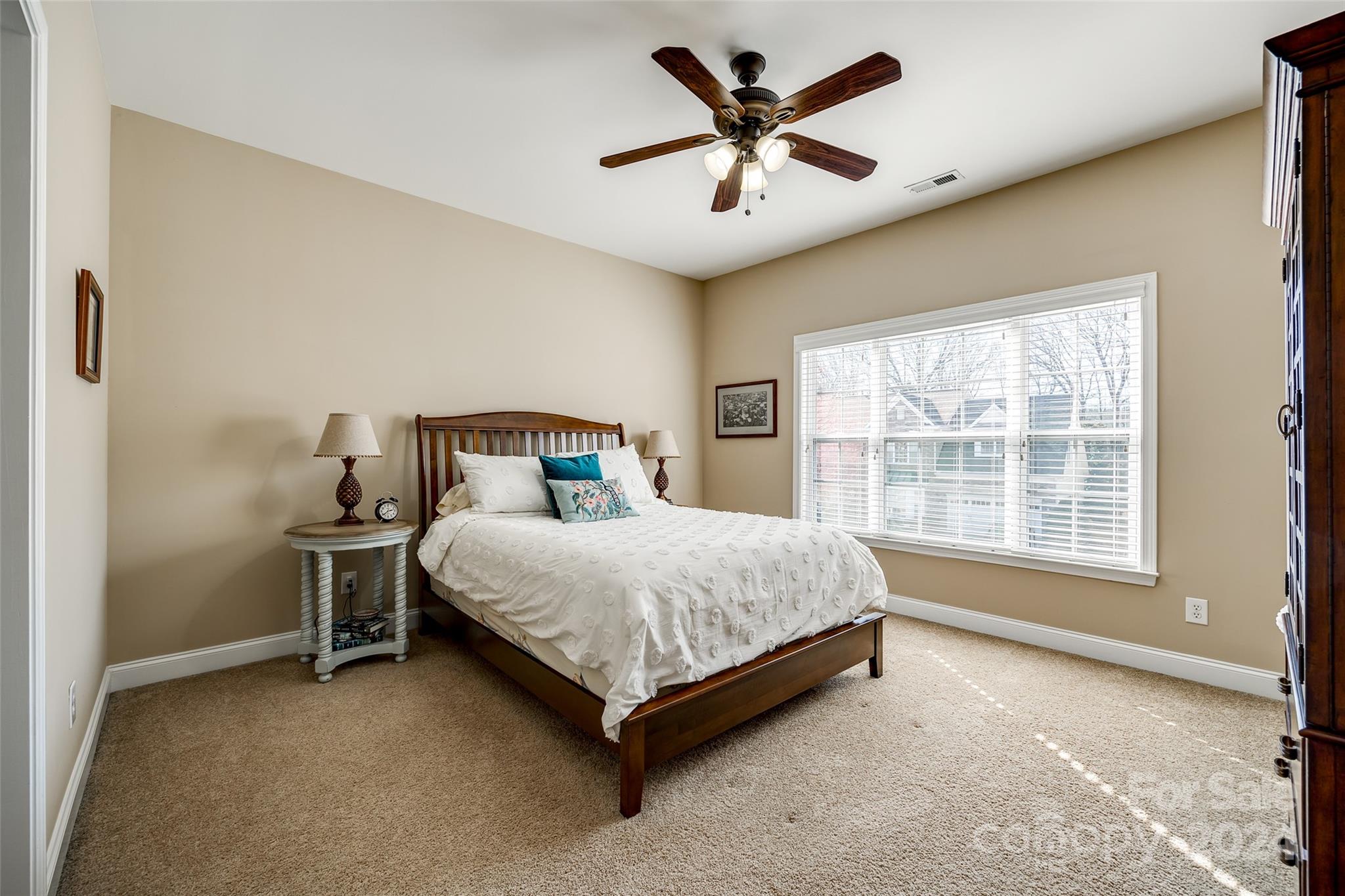674 Quicksilver Trail Fort Mill, SC 29708 - Photo 25 of 45 a spacious bedroom with a bed and a large window