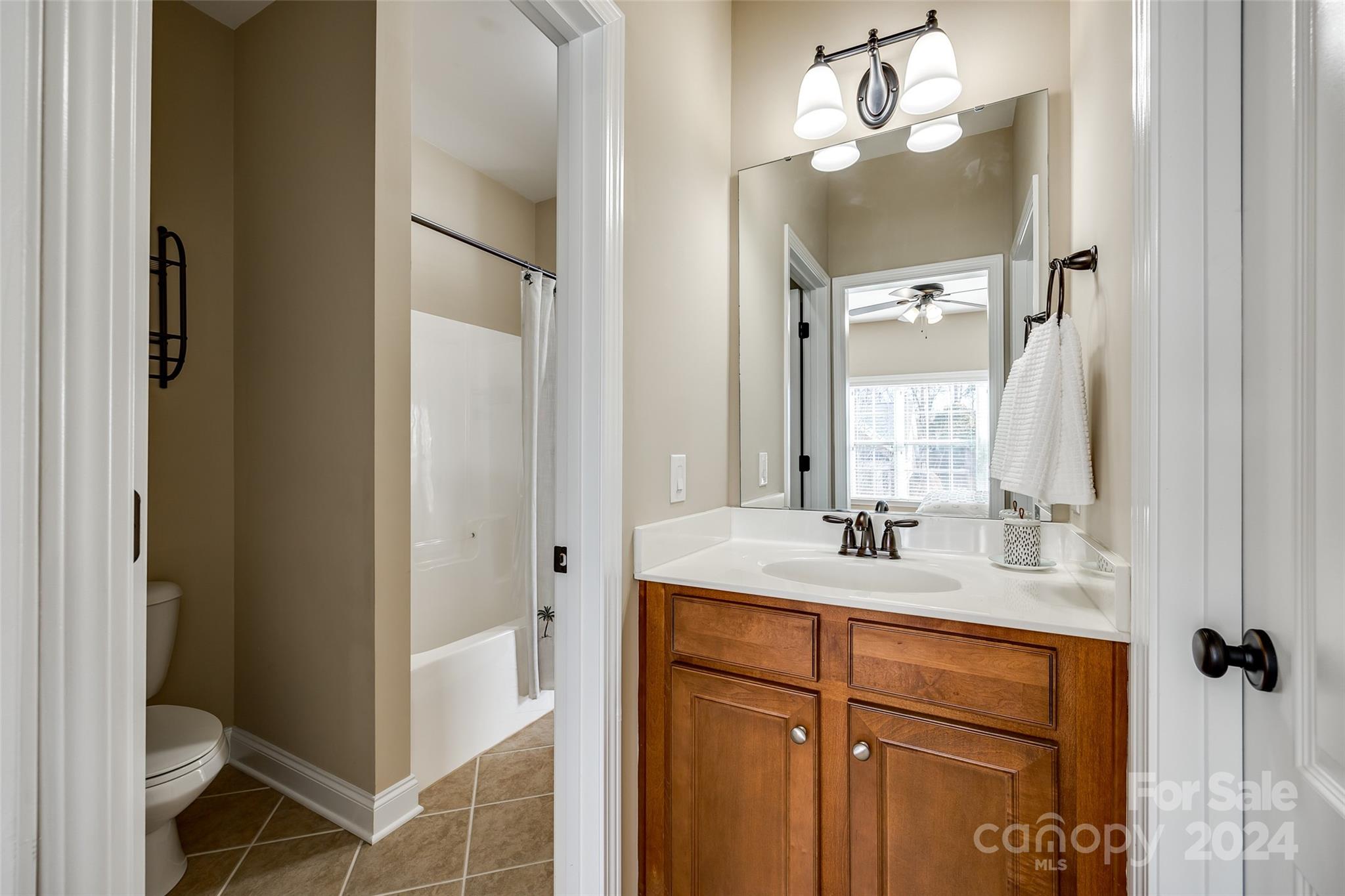 674 Quicksilver Trail Fort Mill, SC 29708 - Photo 26 of 45 a bathroom with a double vanity sink mirror and toilet