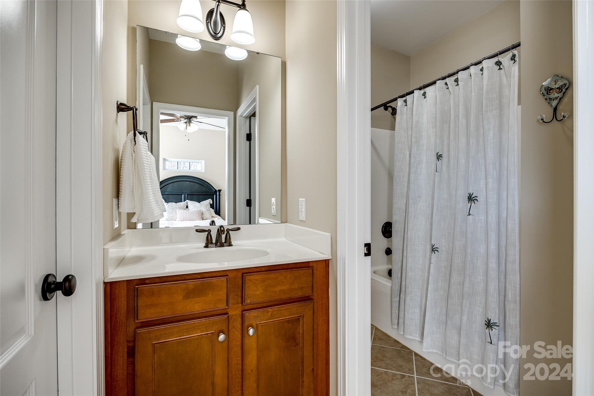 674 Quicksilver Trail Fort Mill, SC 29708 - Photo 28 of 45 a bathroom with double vanity sink and mirror