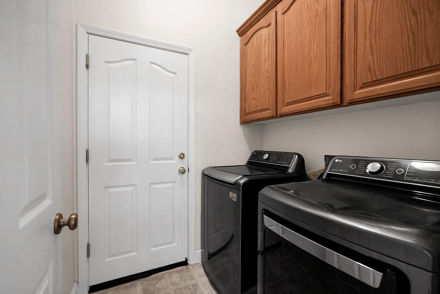 1163 Bailey Drive Ripon, CA 95366 - Photo 23 of 37 Inside laundry room with extra storage and convenience.