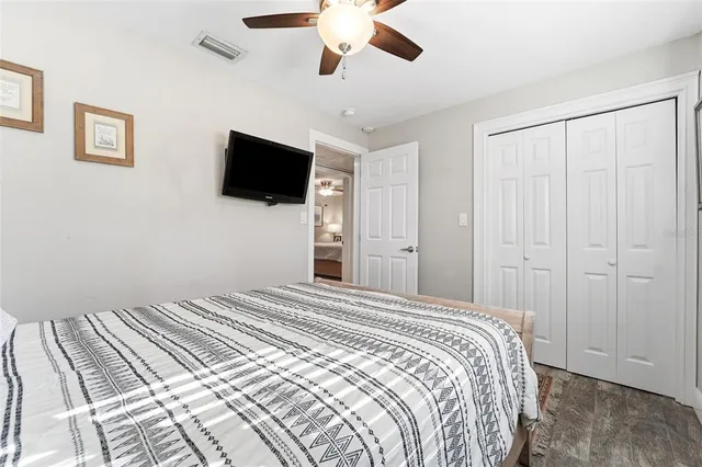 a kitchen with cabinets stainless steel appliances and a window