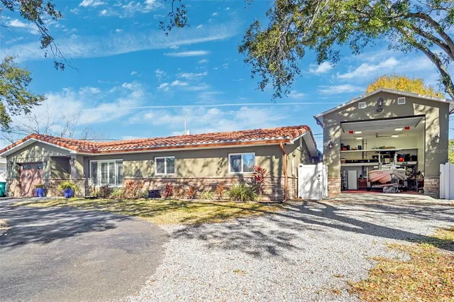 a front view of a building with trees