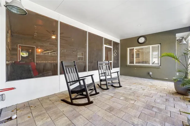 a view of a chairs and table in a patio