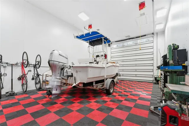 a living room with lots of furniture and kitchen view