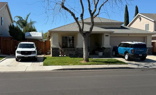 a car parked in front of a house