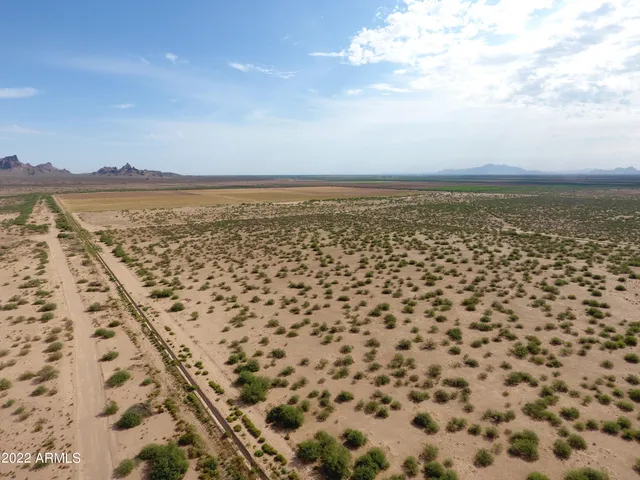 an aerial view of residential building and ocean