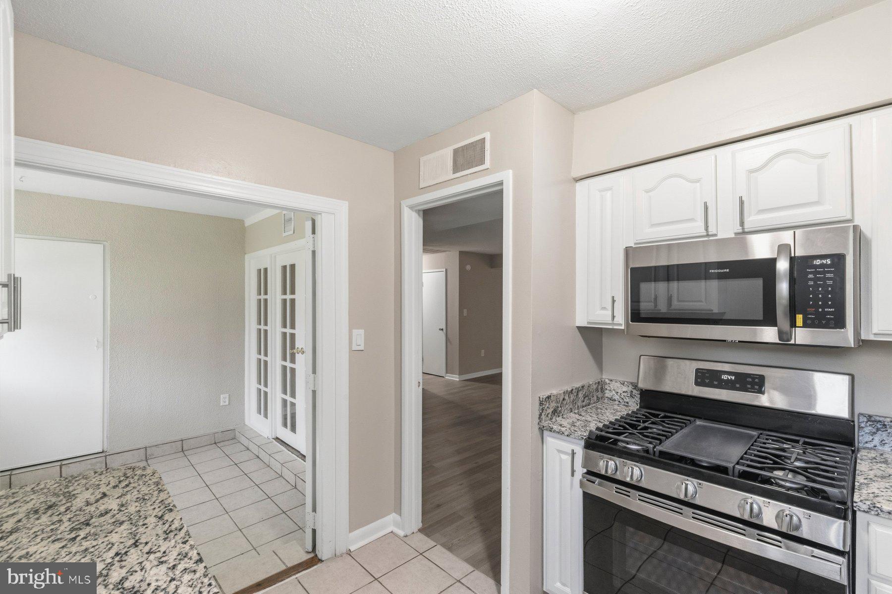 5866 Thunder Hill Road, Unit A4 Columbia, MD 21045 - Photo 4 of 21 Kitchen with brand-new appliances and a countertop