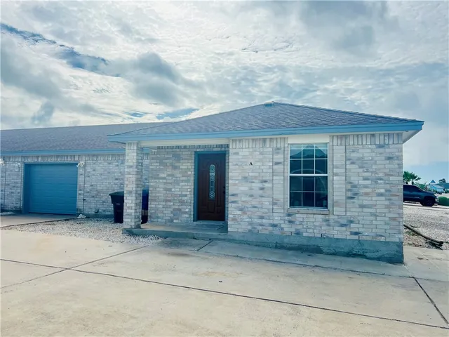 a kitchen with a sink stove and refrigerator