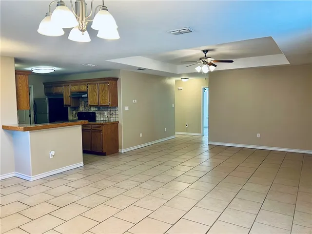a view of a kitchen with a sink and cabinets