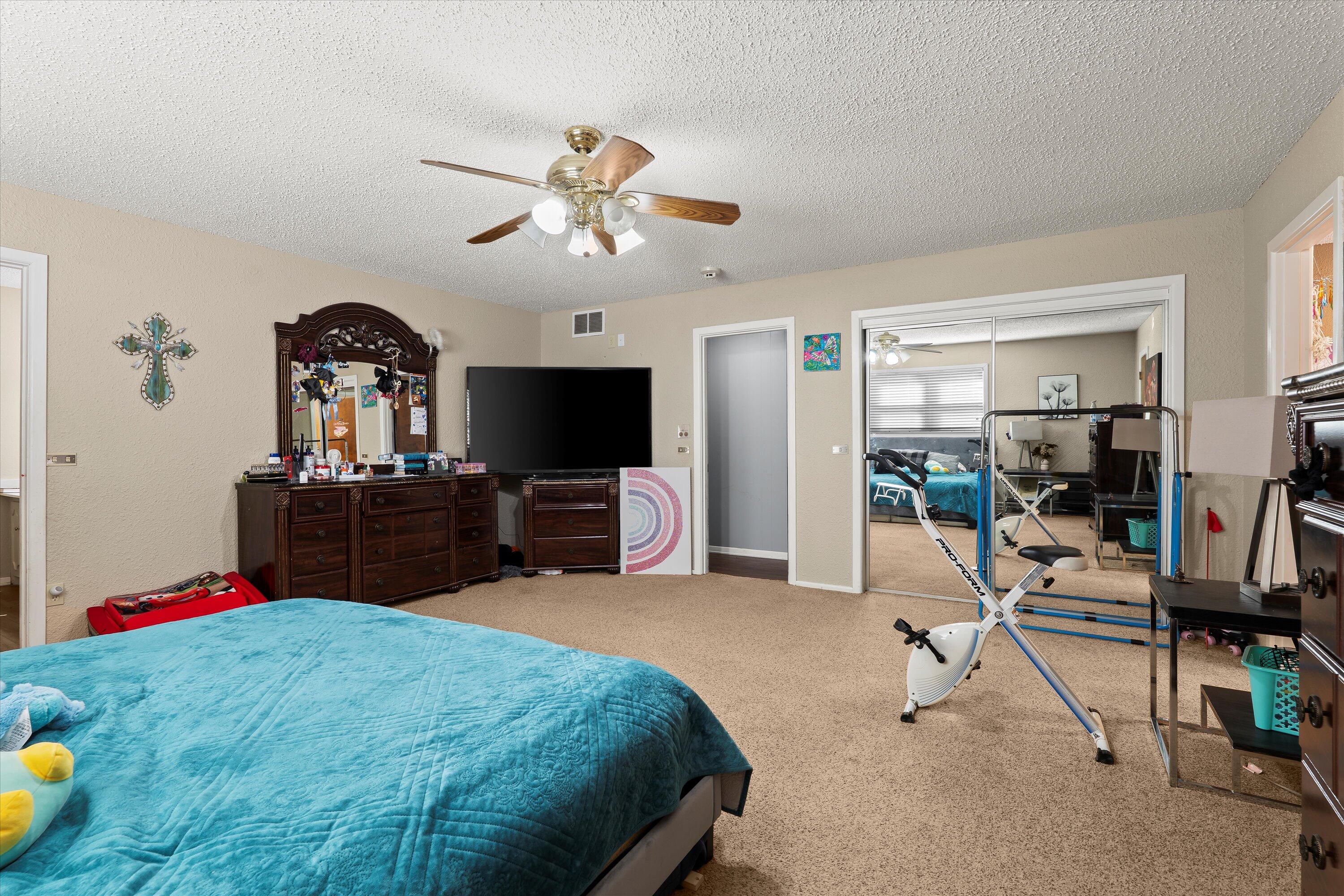 403 Crescent Drive Littlefield, TX 79339 - Photo 16 of 35 a living room with furniture and a flat screen tv